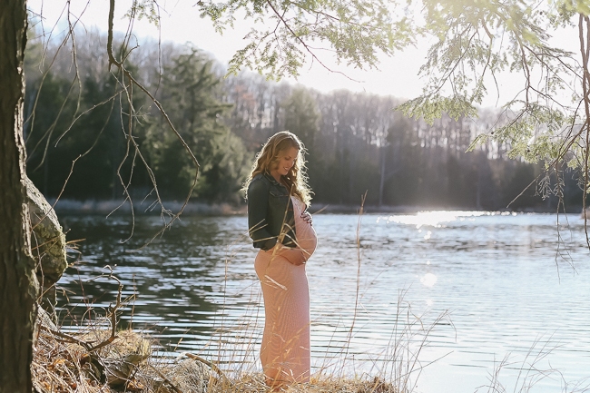 mommy to be in front of lake